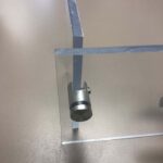 Polished aluminum standoff mounts for plexiglass sneeze barrier